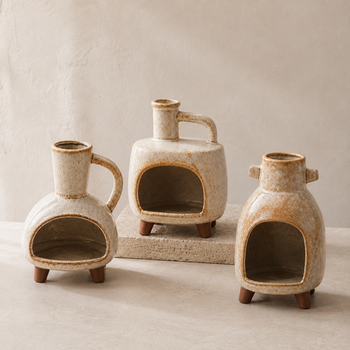 Three cream-speckled ceramic hearth incense burners in Square Handle, Round Loop and Twin Lug forms on pale stone blocks.